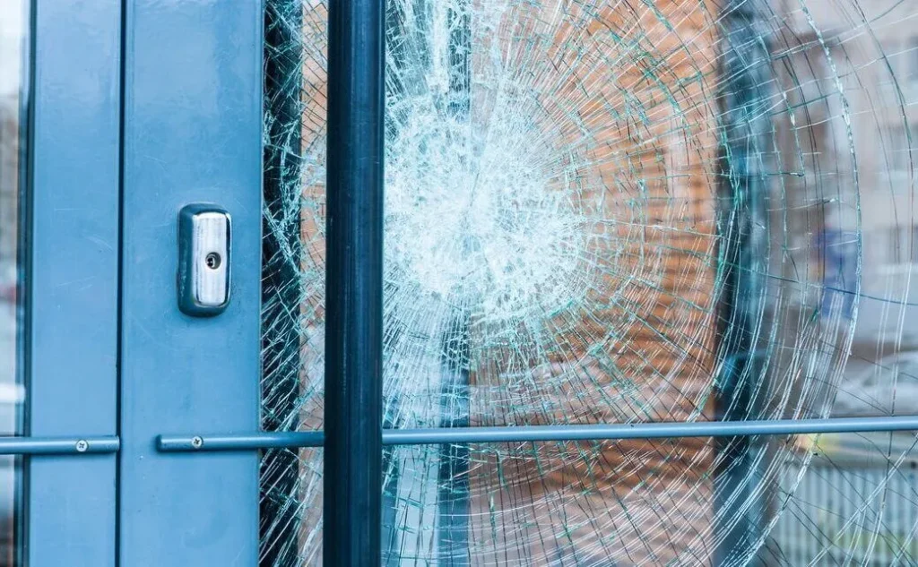 Smashed glass door panel needing emergency repair